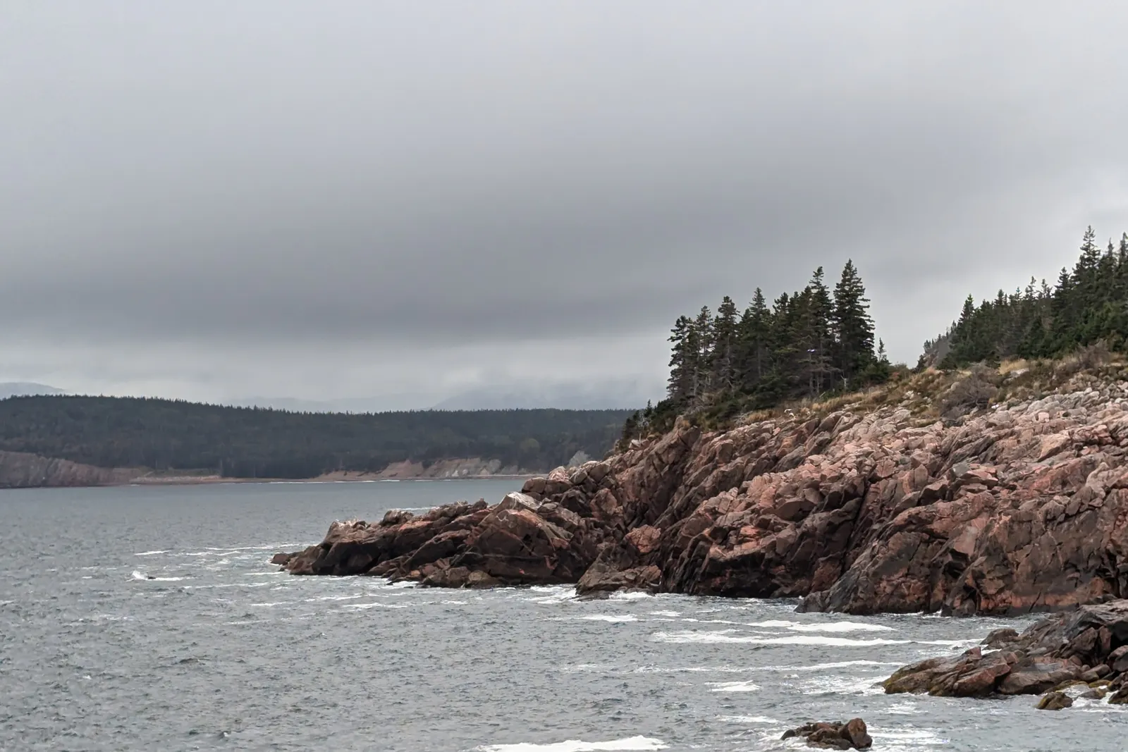 Dramatic rocky coastline and ocean waves on Cape Breton Island