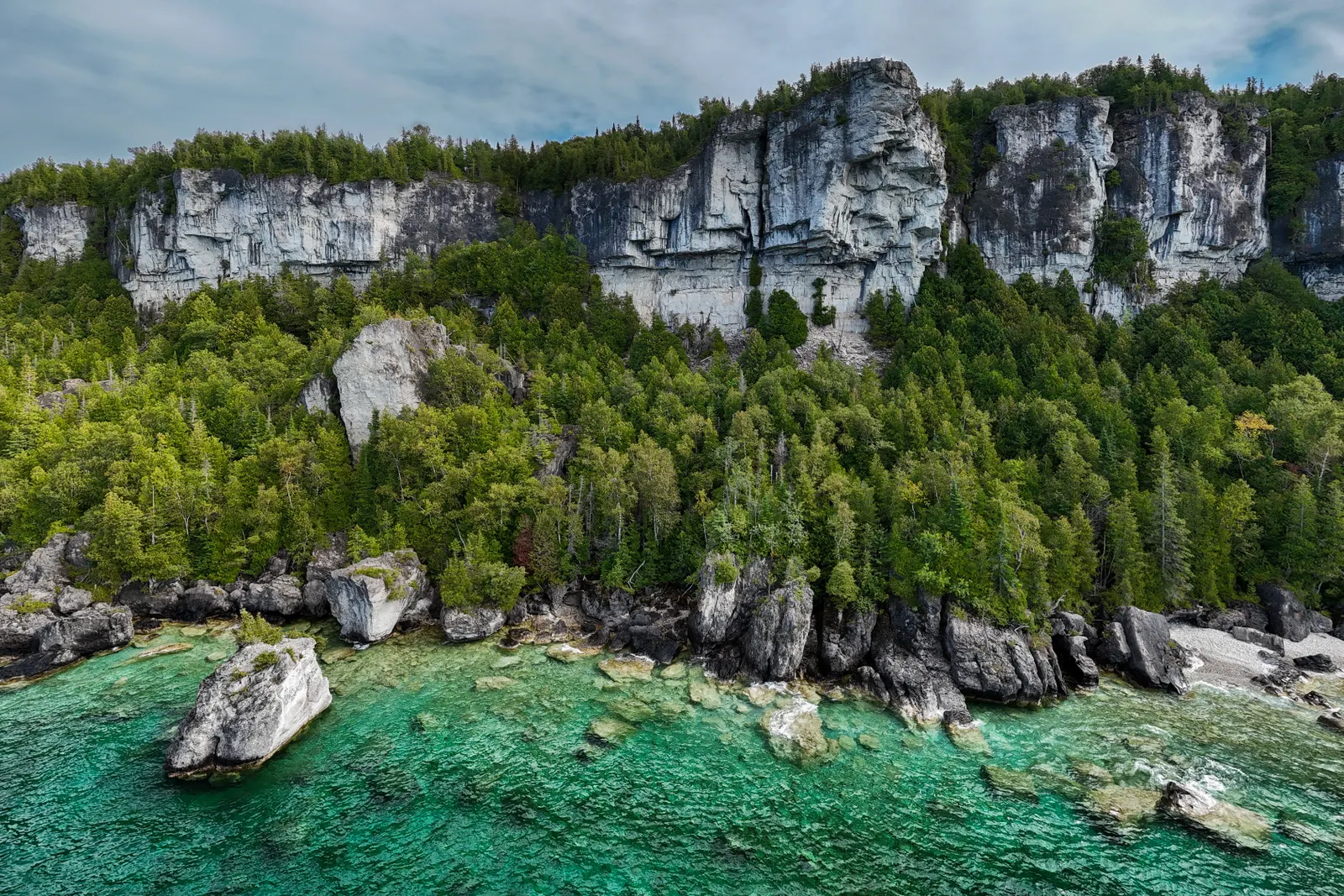 Limestone cliffs and clear turquoise water along the Bruce Peninsula in Ontario